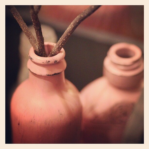 Willow branches for Valentine's tree, stuck in newly distressed pink bottles....